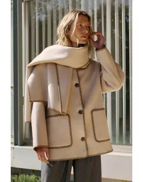 If you like small details, this wool coat with an added scarf is made for you. All the finishes on this garment are hand embroidered, and its regular fit looks great. BY606.
