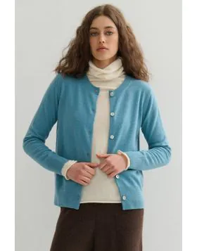 Crafted from pure, raw cashmere fibers, sustainably sourced , this essential cardigan epitomises eco luxury at its finest. This cardigan is the ultimate wardrobe essential, offering unparalleled comfort and timeless style. Its classic crew neck and delica