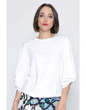 An easy white top is a summer staple and this one fits the bill perfectly. In a round neck and 3/4 sleeves, the the statement gathered sleeve design gives it a little something extra. Style it with easy pants or skirts. 5850.
