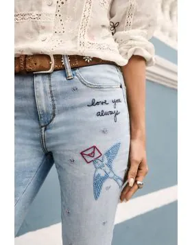 Crafted from a rich cotton blend with a hint of stretch, the Jasmine Honey Cropped Skinny Jeans are embellished with colorful detailed embroidery for a touch of whimsy. Designed with a button and fly closure and pockets at the front and back, these croppe