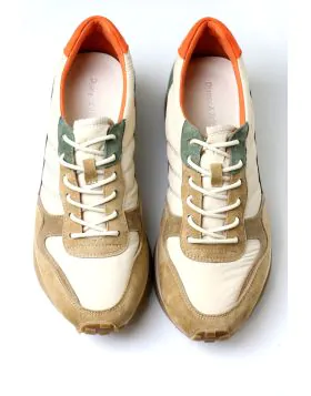 This style features a retro inspired low profile silhouette crafted with a mix of texturized fabrics, nylon, and suede panels. It stands out with a warm, earthy palette featuring neutral cream and khaki overlays, deep forest green accents, and a vibrant p