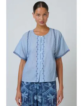 The Elodie Top is an easy, feminine style with beautiful embroidered detailing throughout. Crafted from lightweight cotton, it features a relaxed boxy shape, button through front and softly gathered back for an effortless everyday fit. DE35.
