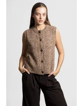 The Button Up Vest offers a fresh take on classic knitwear, merging playful texture with everyday ease and layered charm. It is a must have piece for adding dimension, creativity and warmth to your wardrobe. Crafted from a distinctive nep yarn blend, it c