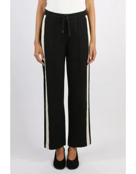 The Century Pant offers a relaxed wide leg fit with an elasticated waistband and drawcord for comfort. Featuring cream herringbone tape along the side seams and a pin tuck stitch down the centre leg, this versatile style blends ease with effortless sophis