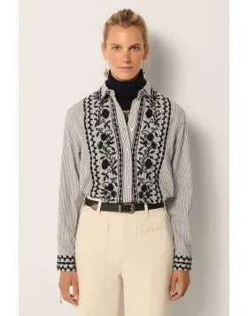 The classic shirt gets a Maison Hotel Makeover in this Amanda Shirt. In an overall stripe, it features a striking embroidery on the front along with a button up and long sleeves. Make the desired and impactful impression in all the right ways.