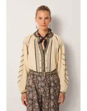 An effortlessly charming shirt by Maison Hotel is a perfect go to for the season. The Ringo Shirt in Crinkle Cotton features an overall striking embroidery and front open neck with front button and full sleeves. Style with easy wide leg pants for an easy 