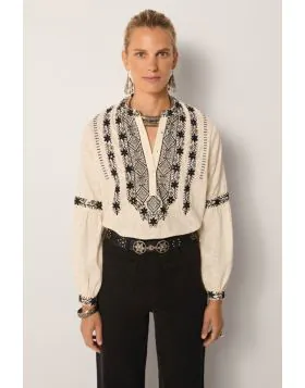 Strut your fashionable stuff everyday with Maison Hotel Bruna Orchid Shirt. The textured cotton shirt has a beautiful and stunning embroidered front along with long sleeves. Style this deluxe shirt with easy high waisted pants and assorted jewels with mes