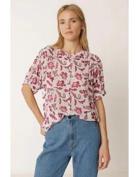 The Floral Shirt in Raspberry from Indi and Cold is a lightweight, softly draping style crafted from a viscose blend. Designed with a round neckline and a button through front, it features short sleeves with gentle gathers at the shoulder and an all over 