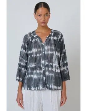 A blouse that does more than just fit its a statement. The P161 combines bohemian charm with refined detailing through its delicate pintuck pleating and a button front design, complemented by cropped balloon sleeves and a shirred neckline for a touch of f