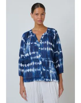 A blouse that does more than just fit its a statement. The P161 combines bohemian charm with refined detailing through its delicate pintuck pleating and a button front design, complemented by cropped balloon sleeves and a shirred neckline for a touch of f