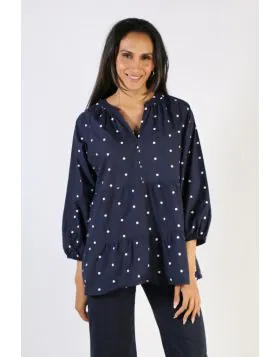 This lovely embroidered spot top effortlessly blends a boho chic shape with a classic navy and white spot. Made from a soft and breathable cotton voile, this blouse features a V-neckline, full length sleeves, a tiered bodice and embroidery detail. Perfect