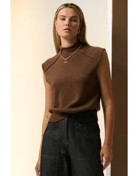 With a funnel neckline and a sleeveless design, the Sable Knit Tank is an elevated knit top perfect for transseasonal wear. Full neckline and rolled edge. STYLE PP5652.