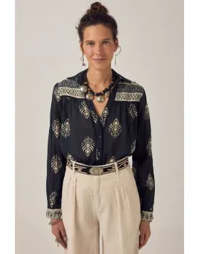 Long sleeve shirt in lightweight cotton. Collared, button down front, button cuffs. Cut from the signature shirt pattern soft, breathable, falls naturally on the body. Easy structure, familiar fit. Deep black base with henna inspired print. Floral forms a