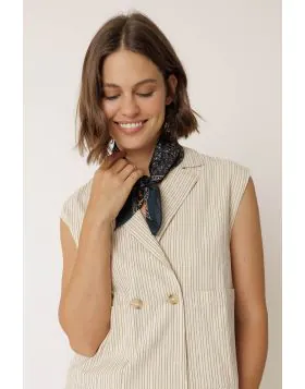 This scarf will elevate all your looks. It is made from organic cotton and features a block print with a floral border. RG657.
