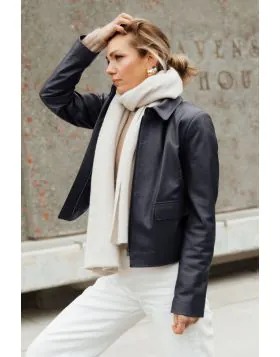 A clean cut leather jacket with a softly structured shape that feels polished without being overdone. The rich hazelnut tone adds warmth, while the minimal design keeps it timeless and easy to wear. Fitted through the shoulders with a relaxed finish throu