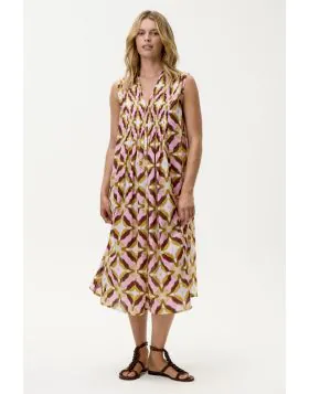 The Tobago Tommy Dress from oneseason captures the carefree essence of sun drenched days with a distinctly feminine edge. Crafted from lightweight, breathable cotton, this sleeveless silhouette is designed with a flattering V neckline and delicate pintuck