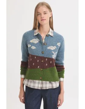 Inspired by the peaceful charm of the Dutch countryside, this cozy knit sweater captures a scenic landscape of Holland complete with rolling green fields, soft blue skies, and a classic windmill standing quietly in the distance. Rendered in shades of gree