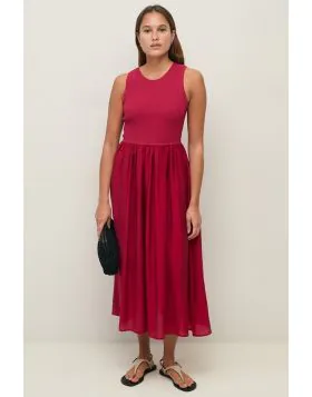 Effortlessly elegant, our Maxi Dress features a fitted ribbed knit bodice that beautifully shapes and flatters the silhouette, flowing into a floaty, airy skirt that moves with grace. This combination of structure and softness creates a versatile, feminin
