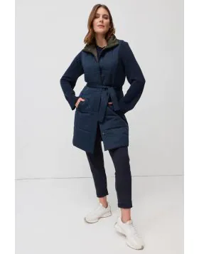 The Reversible Belted Vest is a versatile layering piece designed for warmth through the cooler months. Quilted for a modern puffer inspired look, it features a sleeveless cut, press stud front and a matching waist tie that can be cinched to shape the sil