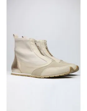 Sleek and sophisticated, this Istra Sneaker Boot by Zeta is a perfect go to for the season. The soft wedge boot has a front zip top in a combination of nylon and leather. Style this Sneaker boot with separates or add an edge to your dresses. 