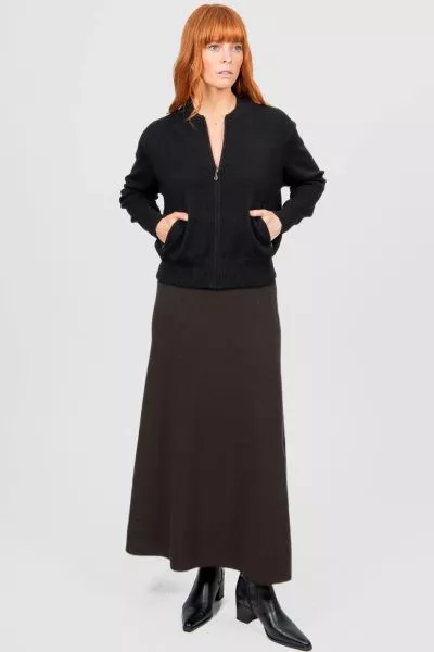 Introducing the new Flared Skirt with Wide Band, a timeless addition to your wardrobe that effortlessly blends classic silhouette and modern comfort. Crafted with meticulous attention to detail, this skirt features a flattering flared cut that drapes beau