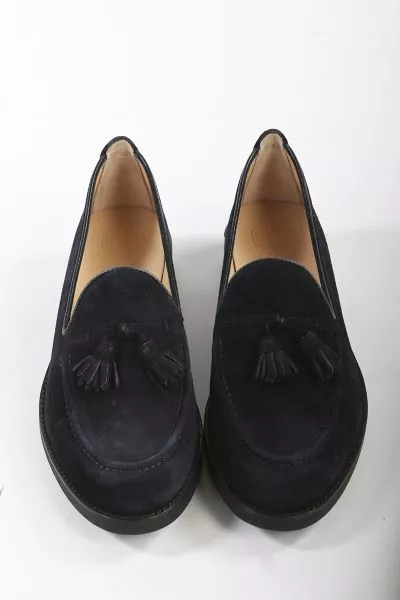 Round toe loafer made in suede. Matching suede tassel trim on the instep. Light, flexible and non slip rubber sole.