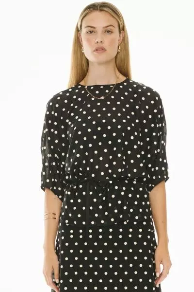 Made from cotton voile with white embroidered polkadots, the Clove Embroidered Top is an elevated take on a tee shape perfect for dressing up or down. style pp5705.