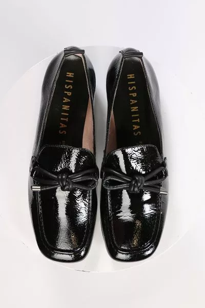 An elegant square toe moccasin made from a soft leather upper with a leather bow embellishment over the instep. Slip on and off with ease. Perfect for work, or for an elevated casual look. European sizing. Made in Spain. Leather upper, microfibre lining, 