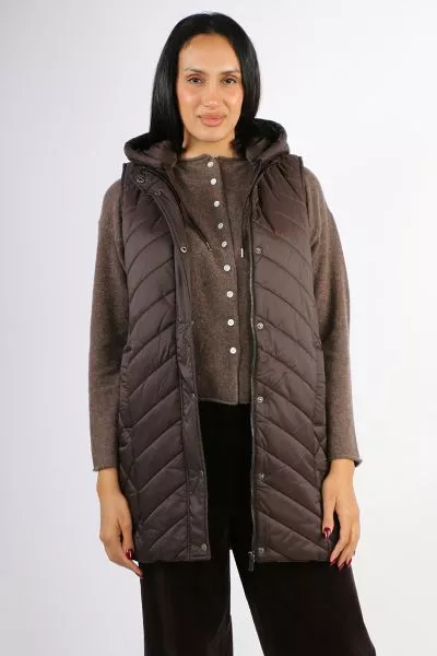 Introducing the Longline Vest, the versatile piece of outwear you will be reaching for this season. Detachable hood with grosgrain tie, Concealed front zip with snap button closure , Lightweight, Side zips. Its longline shape is perfect for when you are o