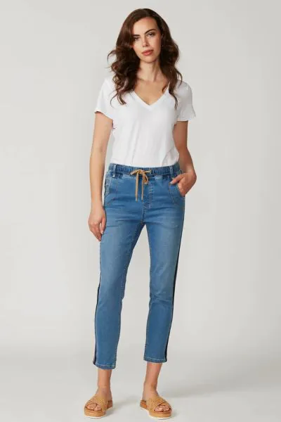 Casual jean with elasticated waist and adjustable drawstring tie. Novelty tape at the outside leg. Soft handle & distressed finish achieved by special garment wash.