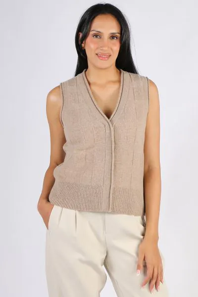 Easy Pippa Vest by Loobies story is a perfect go to for the season. In a 100% Merino, the sleeveless vest in a basket weave can be layered or worn on its own with your favourite pants or skirts. LSK2520.
