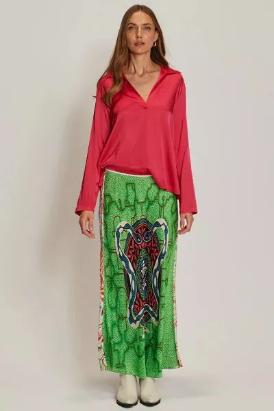 A vibrant take on the classic slip skirt, the Blakely is cut in a flowing maxi length with an elastic waistband for effortless comfort. Designed in a bold snake inspired Shipibo print, it makes a statement on its own or paired with the matching cami.
