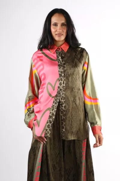 Embrace fearless self expression with this striking blouse that layers heart motifs, animal print, and vibrant colour blocking into one cohesive statement piece. Designed for the fashion forward individual who refuses to blend in, the relaxed silhouette b