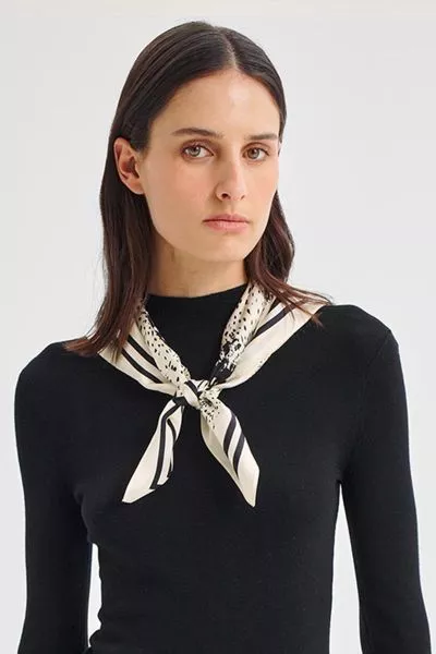 Elevate your look with this luxurious silk crepe satin scarf, crafted from 100% silk for a soft, fluid drape. Featuring an exclusive Morrison print, it adds a refined statement to any outfit.A2931.
