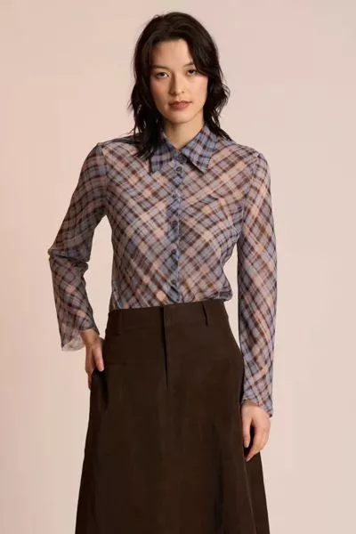 The Edgy Shirt by Neris is an elegant, elevated style crafted with a modern twist. Cut on the bias for a beautifully fluid drape, it features a classic collar and button up front. Raw edging at the hem and sleeves gives the shirt its signature attitude ba