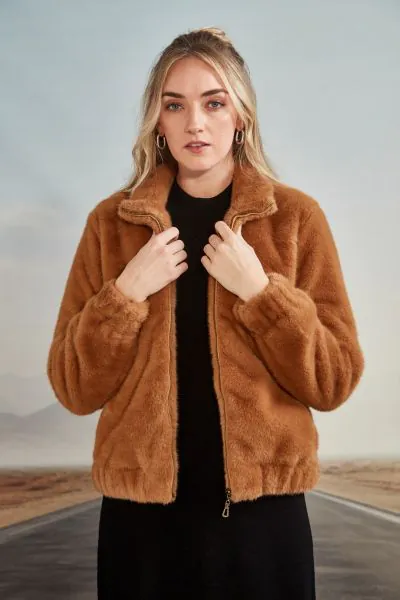 Faux fur bomber jacket with front zip entry and high collar. Zip goes up to the top of the collar. Full length sleeve with concealed elasticated cuff. The Parade jacket falls to the hip with concealed elasticated hemline. Style 9615BR.
