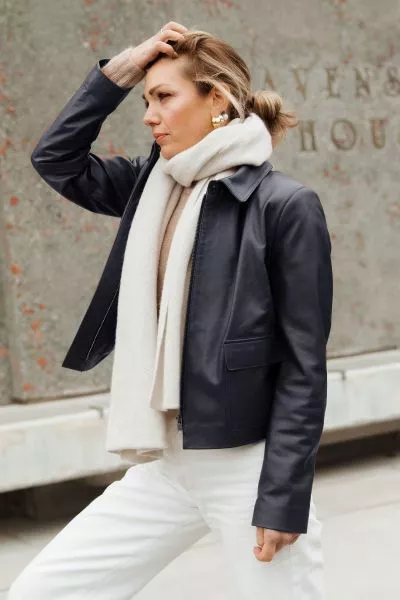 A clean cut leather jacket with a softly structured shape that feels polished without being overdone. The rich hazelnut tone adds warmth, while the minimal design keeps it timeless and easy to wear. Fitted through the shoulders with a relaxed finish throu