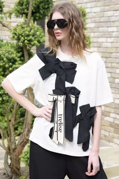 Playful yet polished, the PRESENT DREAMS T shirt from Trelise Cooper makes a subtle statement. Made from COTTON S UP cotton t shirting, it is finished with a fixed grosgrain bow embellishment that adds a touch of charm to its easy silhouette. Playful with