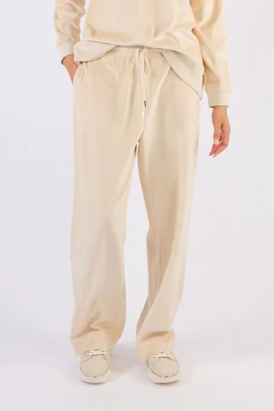 Where comfort meets luxury these velour cotton mid rise waisted pants are the ultimate smart casual leisure pants. Side seam pockets relaxed widish straight legs with adjustable drawstring waist. Team back with the matching zip jacket or simply with a tee