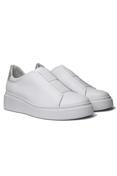 Boost a casual look with the YALES sneaker by Django & Juliette. Crafted from premium leather, the tennis style upper slips on with Double elastic trim in place of laces and rests on a chunky cup sole for sporty glam. Pair with slim jeans and a button-dow