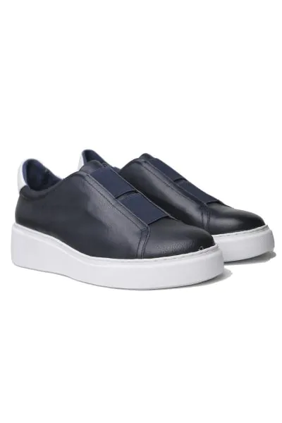Boost a casual look with the YALES sneaker by Django & Juliette. Crafted from premium leather, the tennis style upper slips on with Double elastic trim in place of laces and rests on a chunky cup sole for sporty glam. Pair with slim jeans and a button-dow