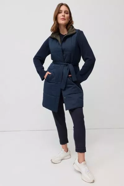 The Reversible Belted Vest is a versatile layering piece designed for warmth through the cooler months. Quilted for a modern puffer inspired look, it features a sleeveless cut, press stud front and a matching waist tie that can be cinched to shape the sil