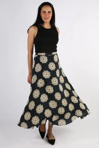 Draping effortlessly, this bias skirt is what you need this summer. Featuring a hand blocked pirnt, this skirt with an elastic band, sits perfectly on your waist. Hugging your curves in all the right place, this ankle length skirt can elevate any basics f