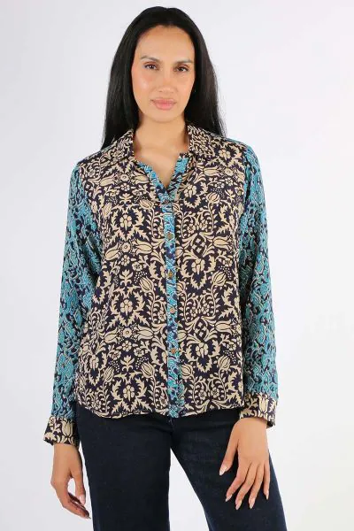 A perfect reason to add a dash of print to the season. The shirt features an overall print in silk crepe de chine. A shirt collar and classic sleeves, take your office dressing up several notches. With a sharp high collar, pair it up with your easy denims