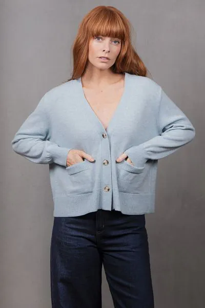 Elevate your layering wardrobe with the V Neck Relaxed Cropped Cardigan, a chic fusion of modern simplicity and cozy comfort. Crafted to be effortlessly versatile, this cardigan features a flattering cropped length and relaxed fit that pairs seamlessly wi