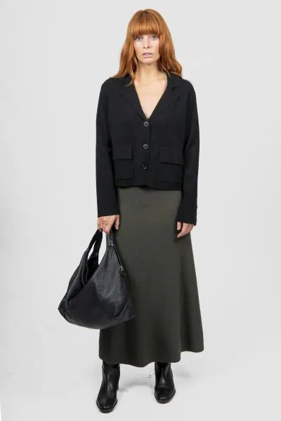 Introducing the new Flared Skirt with Wide Band, a timeless addition to your wardrobe that effortlessly blends classic silhouette and modern comfort. Crafted with meticulous attention to detail, this skirt features a flattering flared cut that drapes beau