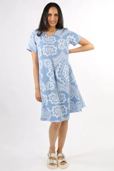Blueberry Italia Linen Short Sleeve Dress. The Blueberry Linen Short Sleeve Dress is a must have wardrobe essential. Crafted from 100% premium linen it boasts an overall batik inspired print, flattering scooped neck, short sleeves, in seam side pockets an