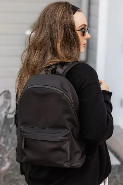 The Carter Black Backpack is a modern essential designed to move with you seamlessly and stylishly. With a softly structured silhouette and thoughtful storage, Carter Black reimagines the classic backpack through a refined, travel ready lens. Crafted for 