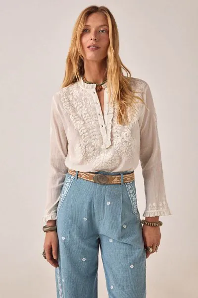 Forever the moment. Embroidered with botanical blooms along the v neckline, this blouse is a must have for anyone building their capsule wardrobe. Designed with a relaxed fit and frilly broderie along the button placket, it pairs exceptionally well with d