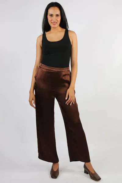 Sleek, fluid, and sophisticated, the Opera Wide Leg Pant brings effortless glamour to any occasion. Crafted from a soft satin fabric with a beautiful drape and subtle sheen, these pants offer a high rise fit and a relaxed wide leg silhouette that flatters